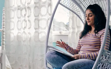 Student taking notes image